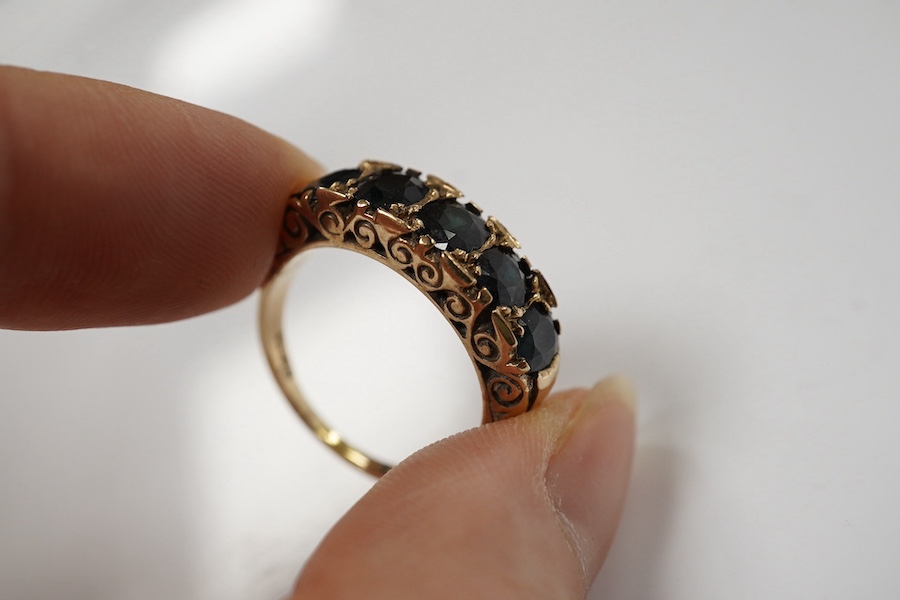 A 1970's Victorian style 9ct gold and graduated five stone sapphire set half hoop ring, size Q, gross weight 5.6 grams. Condition - fair to good